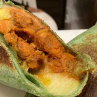Veggie Breakfast Burrito · soft scrambled eggs, re-fried beans, roasted yams, chihuahua cheese, spinach