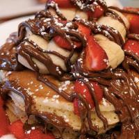 Nutella Hazelnut Pancakes · Buttermilks topped with fresh bananas, strawberries, and nutella hazelnut spread.