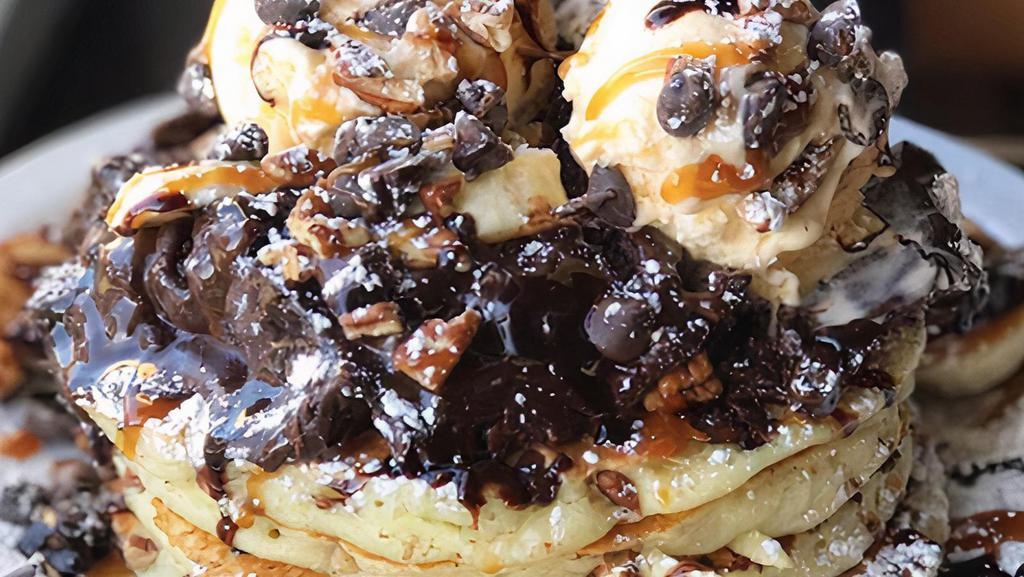 Brownie Sundae Pancakes · Our buttermilks baked with chocolate chips, topped with a warm fresh brownie, vanilla ice cream, chocolate, and caramel sauce.