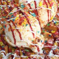 Fruity Pebbles Waffle · Baked with fruity pebbles cereal, topped with vanilla ice cream, whipped cream, vanilla, and...