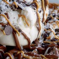 Oreo Nutella Waffle · Baked with oreo cookies and topped with vanilla ice cream, oreos, shredded coconut, chocolat...