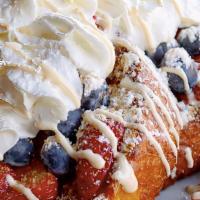 Berry Crisp French Toast · Our fresh baked challah bread deep fried crispy topped with fresh berries, whipped cream, gr...