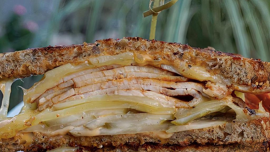 Vanessa'S Famous Grilled Cheese · Roasted Turkey, imported Swiss cheese, sliced kosher dill pickles and thousand island dressing, pressed artisan multigrain bread, served with French fries, coleslaw and pickle.