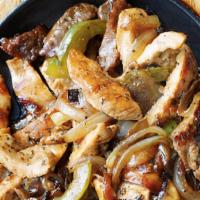 Chicken Fajita · Served sizzling tableside with grilled onions, peppers and mushrooms and accompanied with wa...