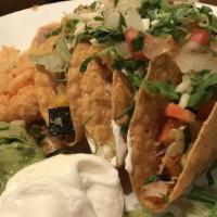Tacos · Three corn tortillas (hard) or two hand-rolled flour tortillas (soft), served with cheese, l...