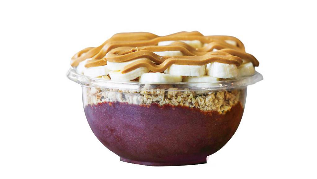 Muscle Up Bowl · For our fit cravers - look no further! This Bowl is the perfect mix of chocolate whey protein, organic Açaí and banana base topped with granola, banana, and peanut butter.