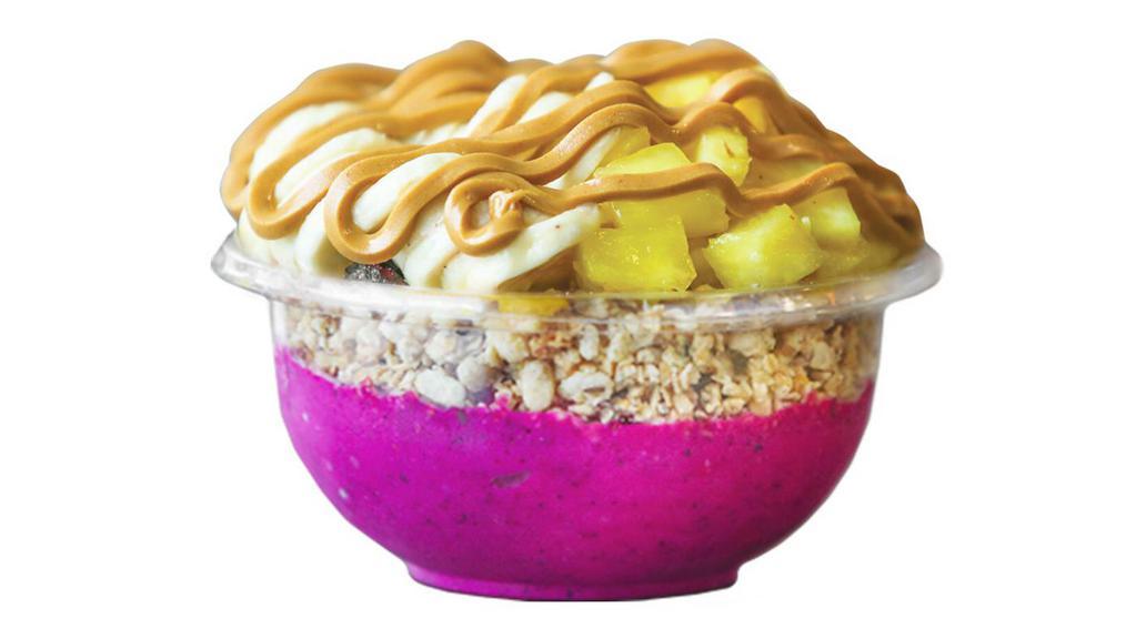 Belize Bowl · Brighten up your day with this tropical a base mix of vanilla whey protein, Pitaya, banana, pineapple and almond milk topped with granola, banana, pineapple and peanut butter.