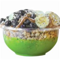 Caveman Bowl · Base: kale, banana, pineapple, almond milk. Toppings: granola, banana, blueberry, almond but...