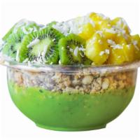 Piña Colada Bowl · Base: kale, banana, pineapple, sweetened almond milk. Toppings are granola, pineapple, kiwi,...