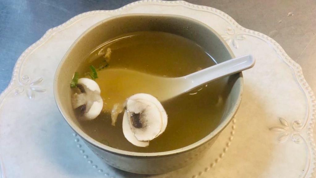 Clear Soup · Clear broth with mushroom and scallion.