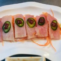 Yellowtail Jalapeño · Thinly sliced yellowtail and jalapeño with special sauce.