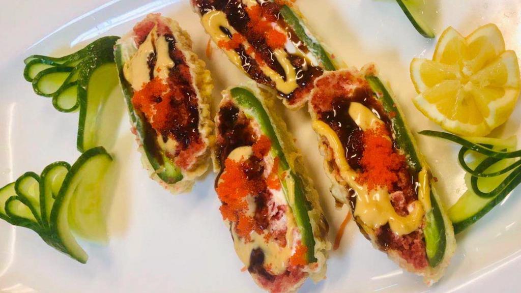 Spicy Tuna Jalapeño · Deep-fried spicy tuna, cream cheese with eel sauce and spicy mayo sauce, caviar, and scallion on top.
