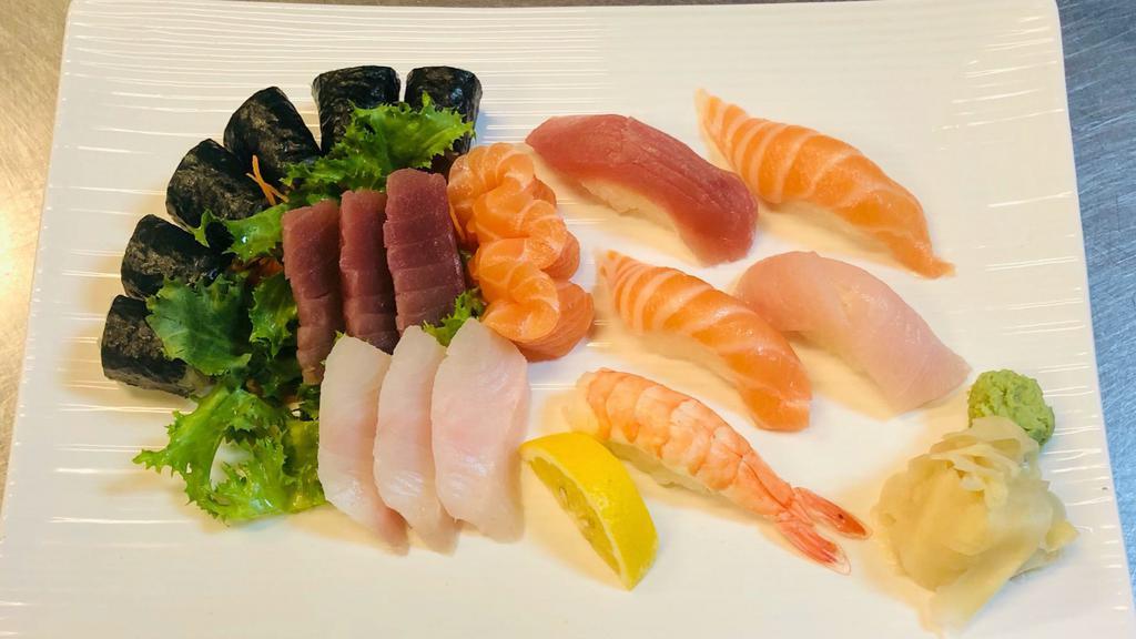 Sushi & Sashimi Combo · Five pieces of chef's choice sushi, nine pieces of assorted sashimi and one tuna roll. Served with soup or salad.