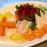 Chirashi · Twelve pieces of chef's choice assorted raw fish over sushi rice. Served with soup or salad.