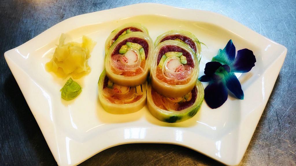 Triple Naruto Roll · Fresh salmon, tuna, yellowtail, crabmeat, and avocado, wrapped with cucumber.