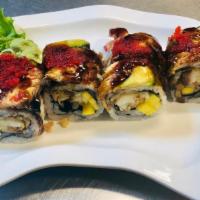 Jimmy Roll · Lobster tempura, mango, and cucumber inside. Topped with eel, avocado, eel sauce, and tobiko.