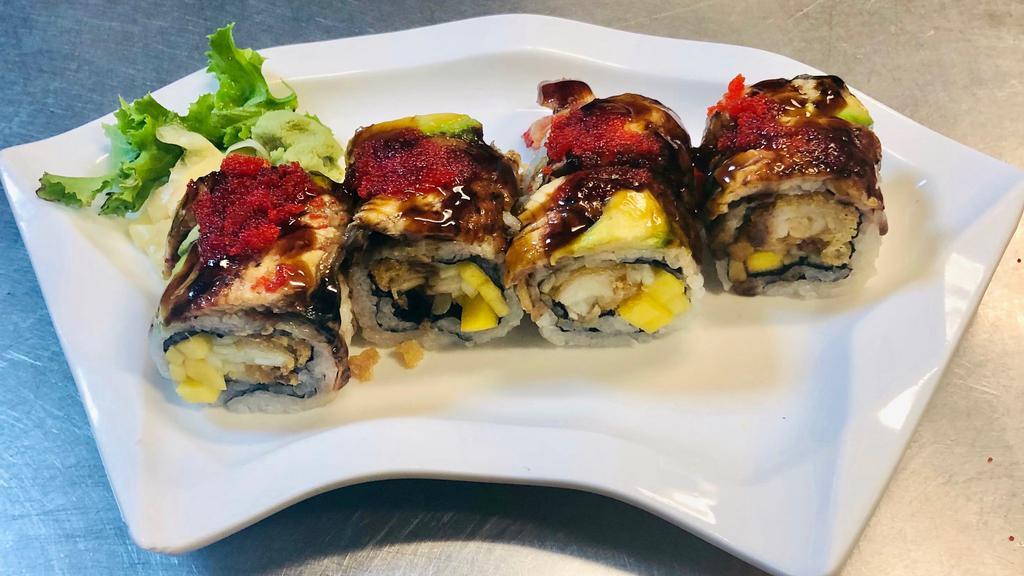 Jimmy Roll · Lobster tempura, mango, and cucumber inside. Topped with eel, avocado, eel sauce, and tobiko.