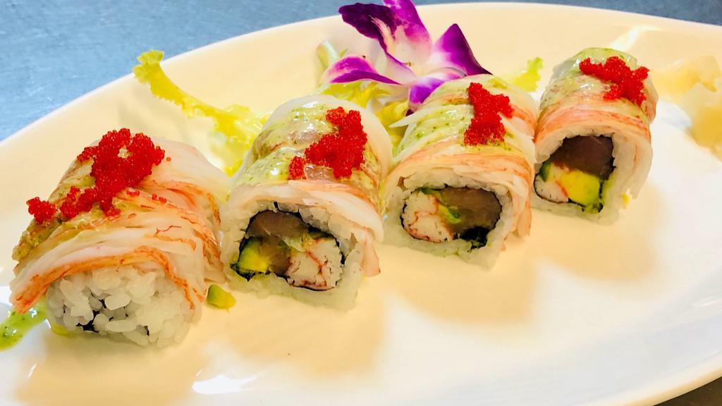 Coral Shrimp Roll · Jalapeño, crab, tuna, and avocado with sweet shrimp, crab and coconut sauce with scallions on top.