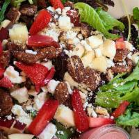 Apple Pecan Salad · Mixed greens tossed with apples, candied pecans, and house-made raspberry vinaigrette. Toppe...