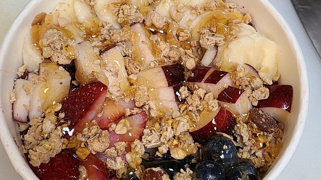 Acai Bowl · Acai blended with strawberries, blueberries, banana and apple juice. Topped with bananas, blueberries, strawberries, apple, granola and honey.