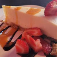 Cheesecake · fresh strawberries and choice of chocolate or caramel drizzle.