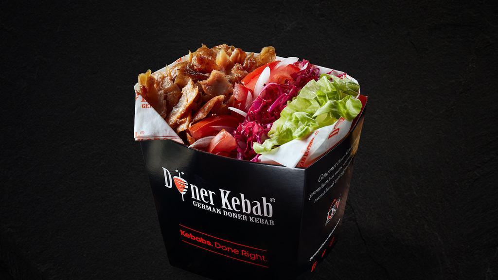 Doner Gym Box · Your choice of doner meats, fresh lettuce, red cabbage, onion, and tomato. Served with 3 signature sauce dips.