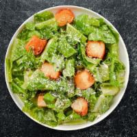 The Classic Caesar · Romaine lettuce, croutons, and a touch of parmigiana cheese.
