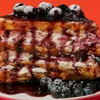 Blueberry Stuffed French Toast · Four slices of egg-washed french toast stuffed with cream cheese and blueberries and topped ...