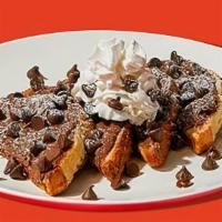 Chocolate Chip Nutella French Toast · Four slices of egg-washed french toast topped with nutella, chocolate chips, whipped cream, ...