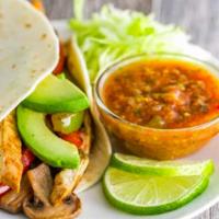 2 Taco Fajitas · Sautéed onions and peppers, guacamole, Jack cheese with chicken or steak in a flour tortilla.