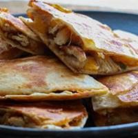 Blackened Quesadilla · Blackened chicken, melted Jack cheese in a flour tortilla. Served with fresh chopped tomato ...