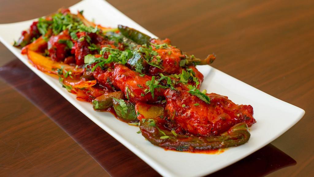 Chicken Manchurian · Tossed in a spicy and sweet chutney.