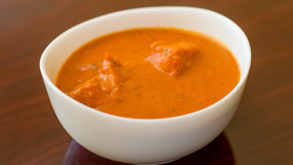 Chicken Tikka Masala · Tender chicken pieces are marinated and finished in fenugreek flavored tomato sauce and cream. Served with basmati rice.