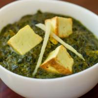 Saag Paneer · Spinach cooked with cheese cubes and seasoned with freshly ground herbs.  Served with basmat...