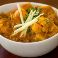 Aloo Gobi · Potatoes and cauliflower with cumin and spices. Served with basmati rice.