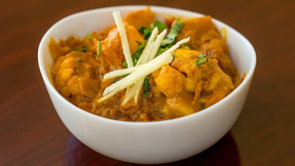 Aloo Gobi · Potatoes and cauliflower with cumin and spices. Served with basmati rice.