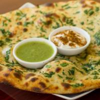 Aloo Paratha · Mashed potatoes stuffed into whole wheat bread baked to perfection.