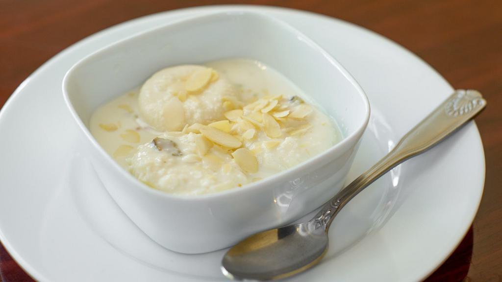 Rasmalai · Cottage cheese cooked with cream and almond sauce.