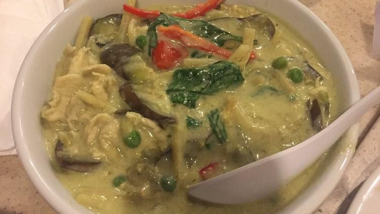 Green Curry · Sliced chicken breast, eggplant, bamboo shoots, lime leaf, peas, & basil in green curry sauce & coconut milk.