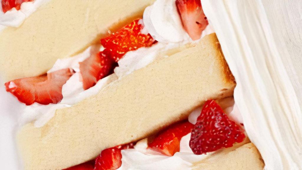 Strawberry Shortcake Slice · Layers of vanilla cake filled with pure whipped cream and fresh strawberries