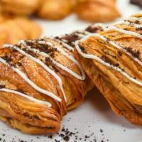 Cookies & Cream Lobster Tail · Crunchy, flaky pastry filled with cookies & cream French cream, drizzled with vanilla icing ...