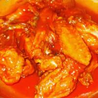 Buffalo Chicken Wings · Crispy to perfection buffalo sauce chicken wings served with celery stick and blue cheese sa...