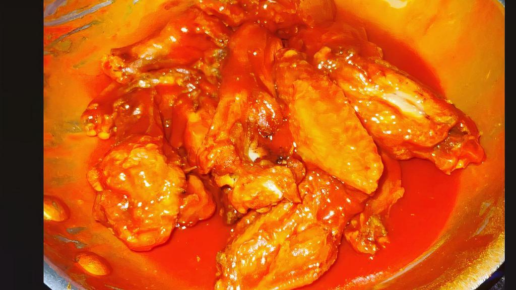 Buffalo Chicken Wings · Crispy to perfection buffalo sauce chicken wings served with celery stick and blue cheese sauce. Jumbo chicken wings made by order