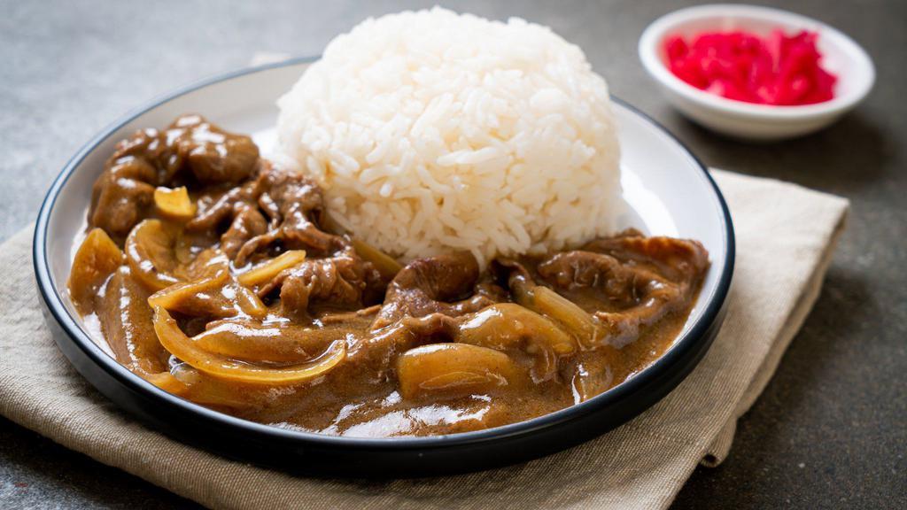 Gyu Don Curry · Tender slow cooked beef with curry, cabbage, and red pickles.