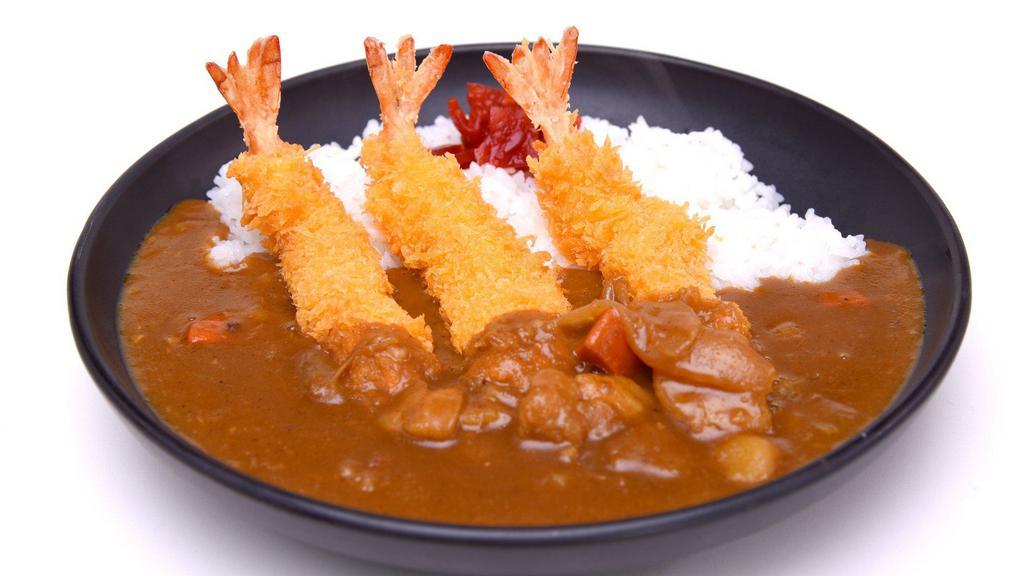 Shrimp Tempura Curry · Three tempura battered large shrimps with fresh breadcrumbs fried to a crispy exterior served with curry, cabbage, and red pickles.