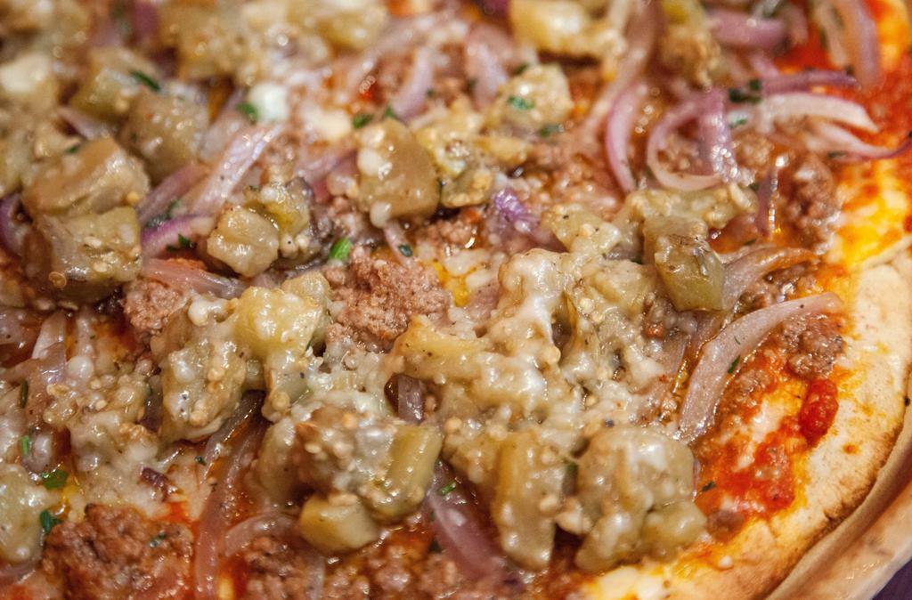 The Moussaka Pitza  · Ground Beef Cooked In Homemade Tomato Sauce With Eggplant, Onions, Light Béchamel And Graviera Cheese