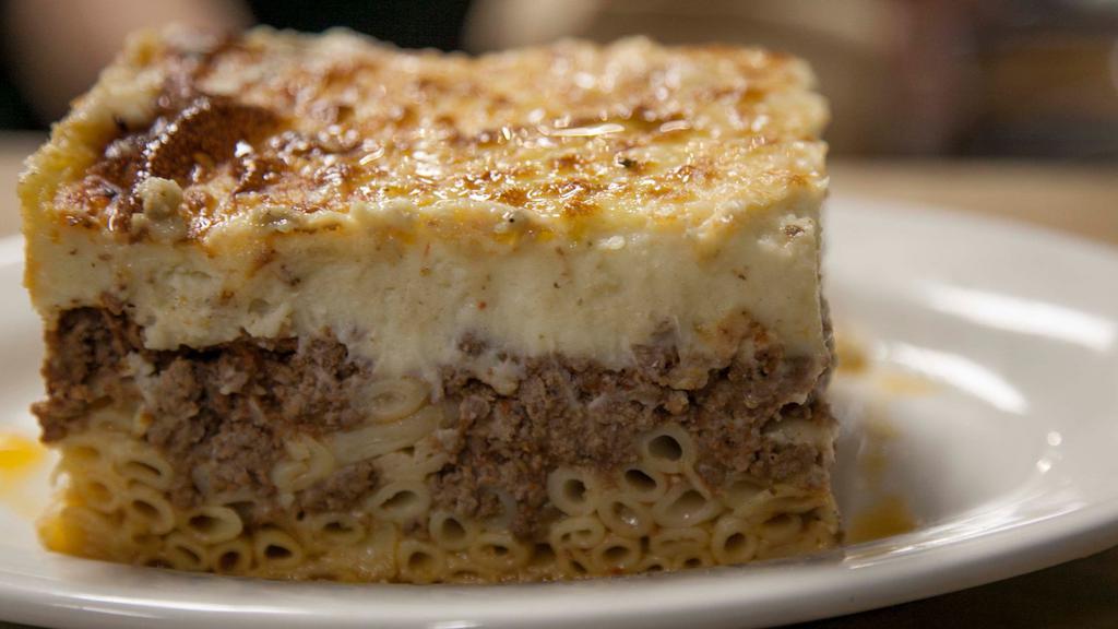 Pastitsio · Traditional baked pasta with ground beef and béchamel sauce.