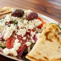 Horiatiki (Greek Salad) · Tomato, cucumber, red onions, feta and kalamata olives.