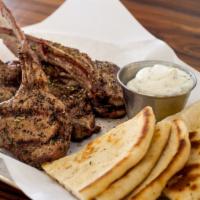 Lamb Chops · Served with pita and tzatziki charcoal grilled and marinated with Greek salt and extra virgi...