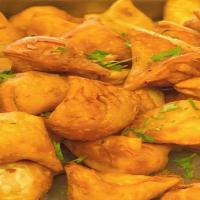 Vegetable Samosa · Deep-fried pastry filled with spiced vegetables, 2 pieces.